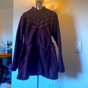 Size large, fits like a medium, handmade purple jacket